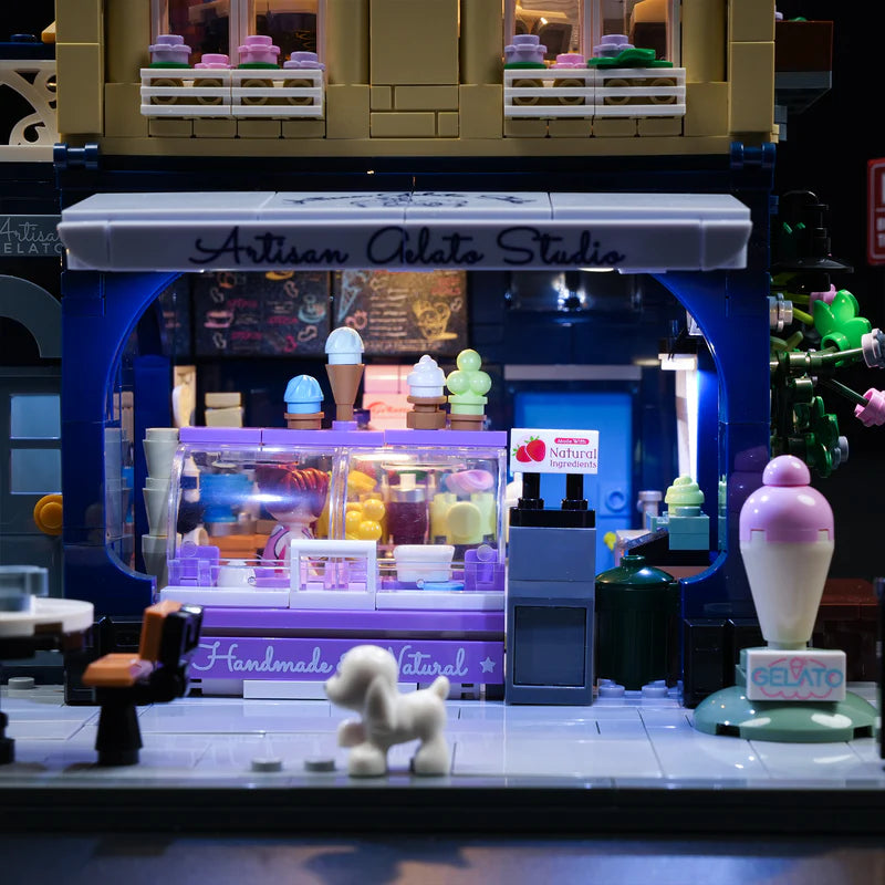 Close-up of Artisan Gelato Studio storefront with purple LED lighting, ice cream display and handmade signage